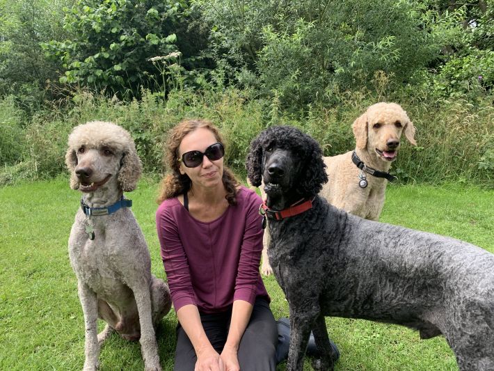 Steph with her three poodles